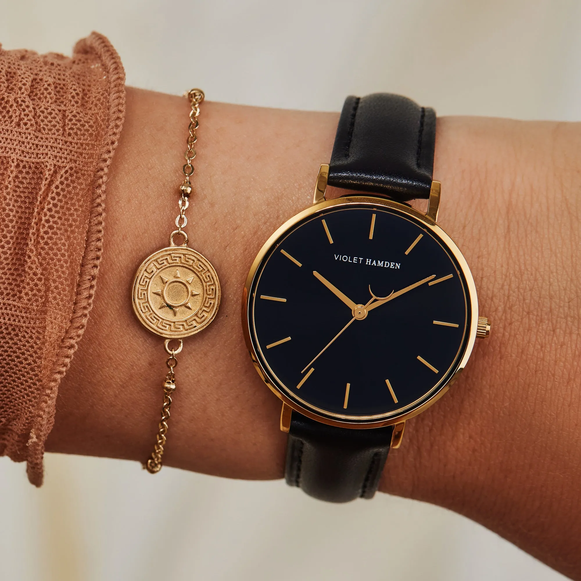 Day & Night round ladies watch gold and black coloured